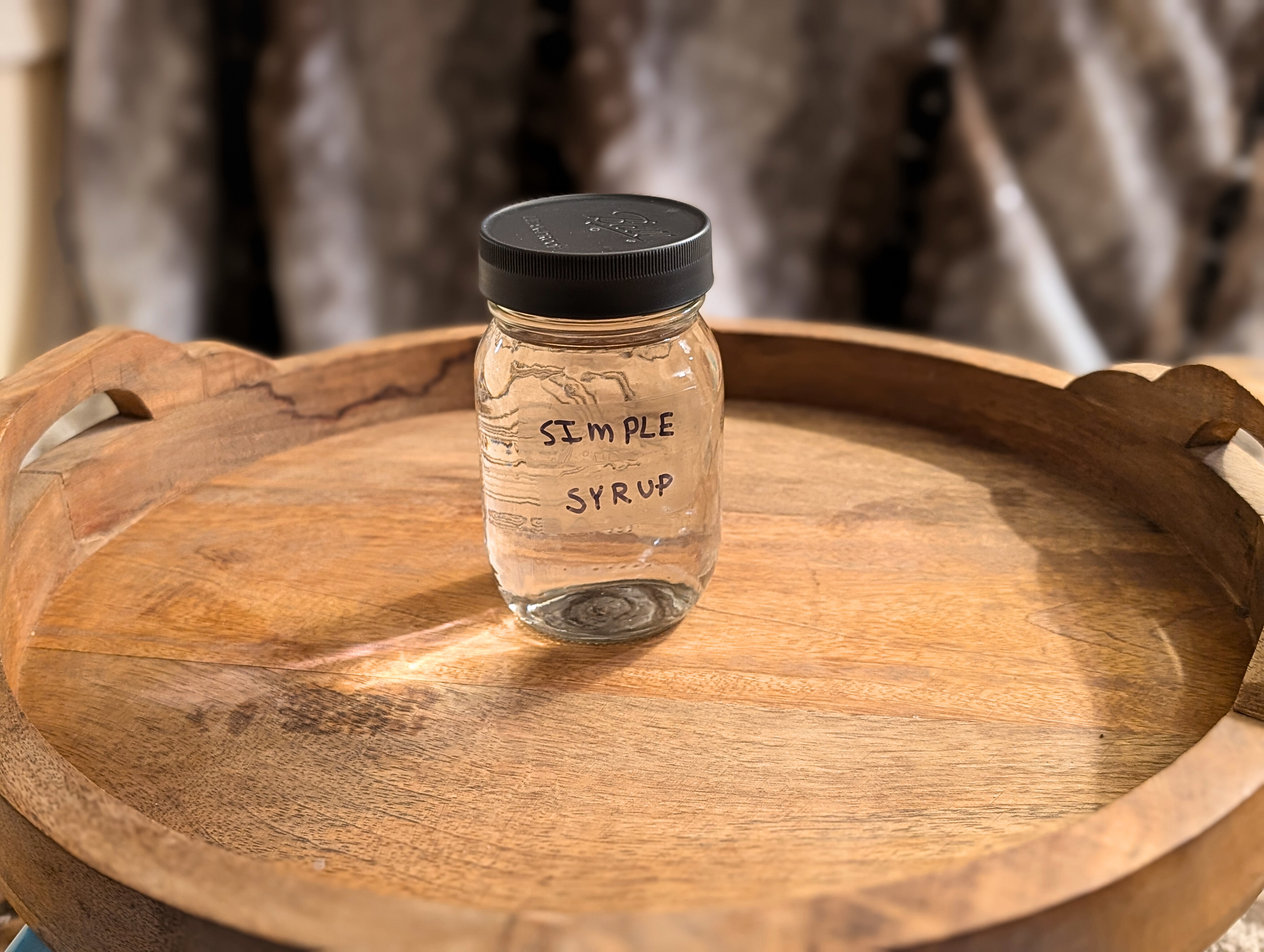 Homemade simple syrup in a glass mason jar